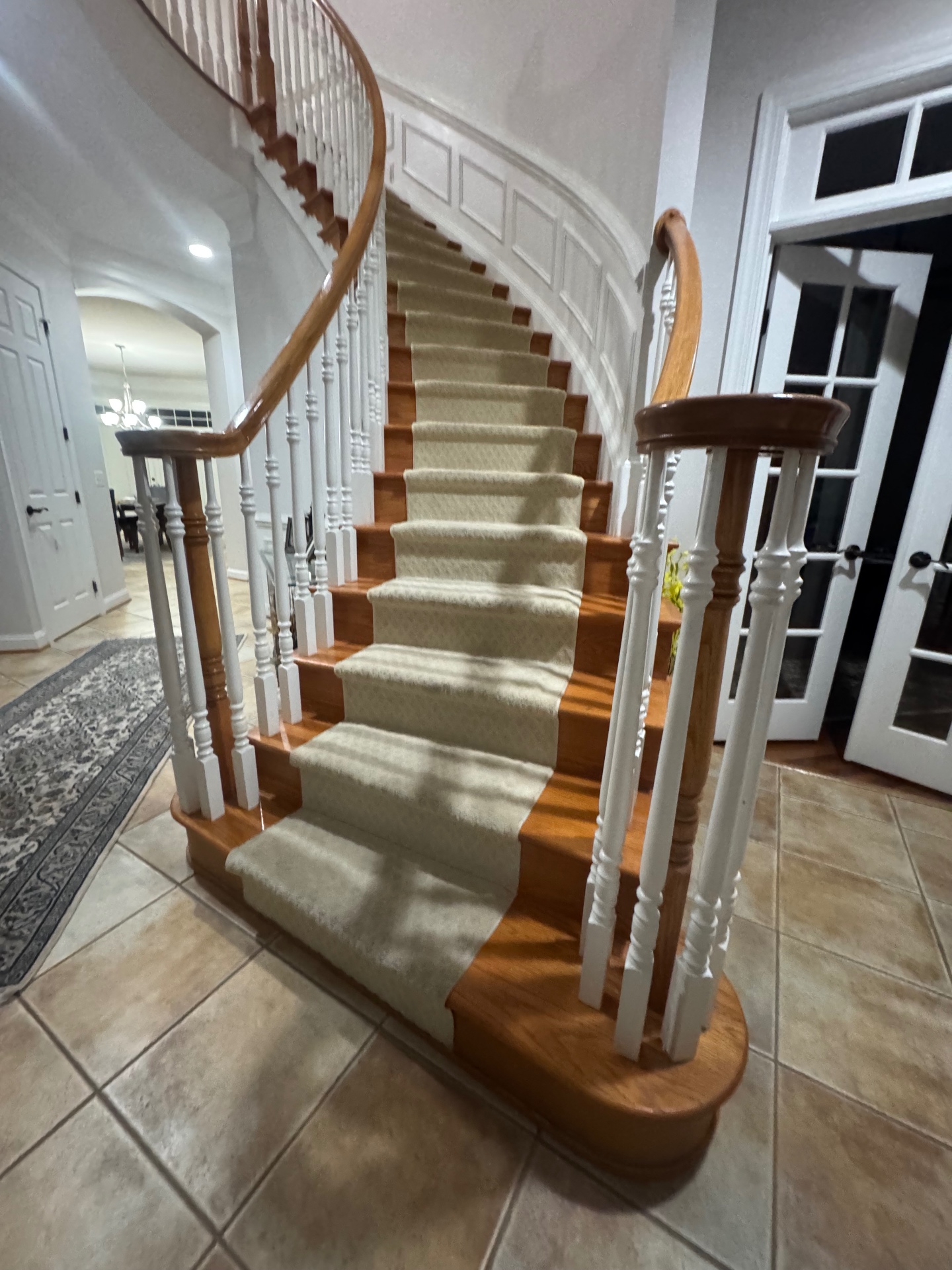 Floating walnut staircase with glass railing